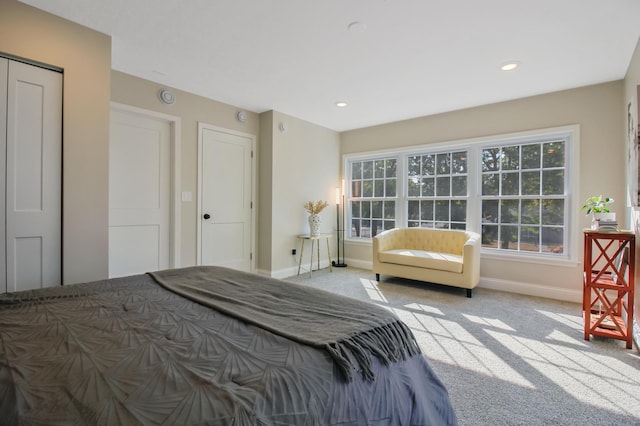 bedroom featuring light carpet