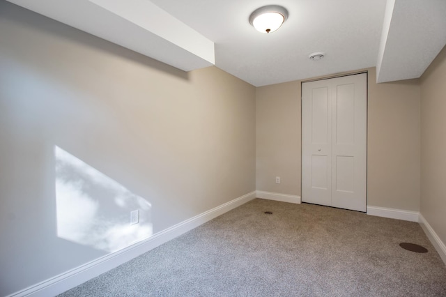 unfurnished bedroom with carpet floors and a closet