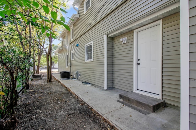 doorway to property featuring cooling unit