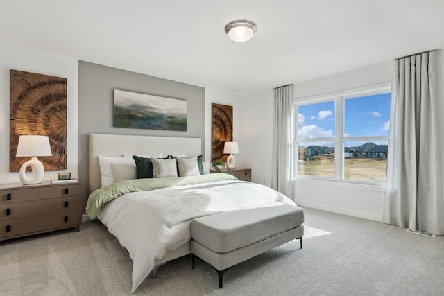 bedroom with light colored carpet