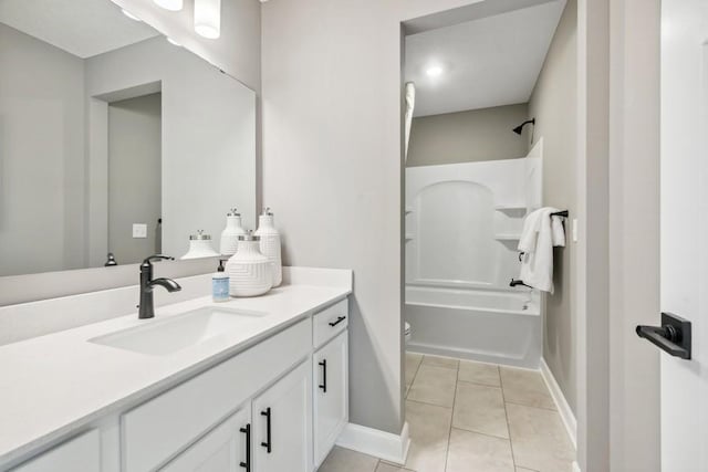 full bathroom featuring vanity, shower / washtub combination, tile patterned floors, and toilet