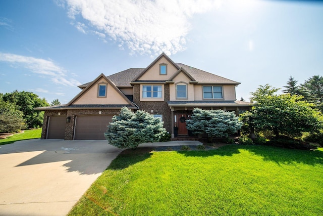 view of front facade featuring stucco siding, an attached garage, concrete driveway, and a front lawn