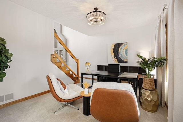 living area with visible vents, stairway, carpet, baseboards, and a chandelier