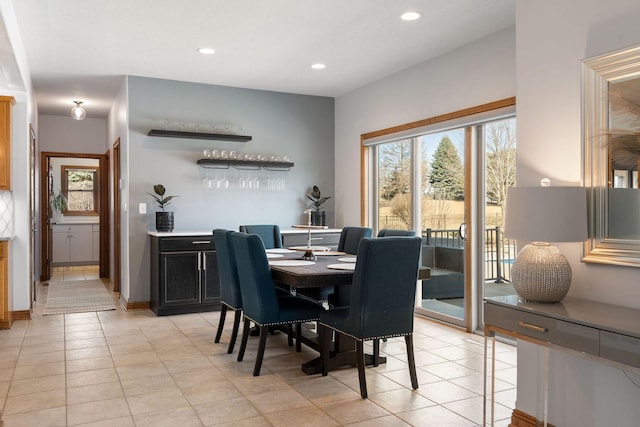 dining room with light tile patterned floors and recessed lighting