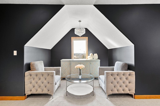 living area featuring an inviting chandelier, lofted ceiling, carpet flooring, and baseboards