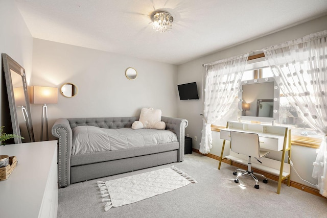 carpeted bedroom with baseboards