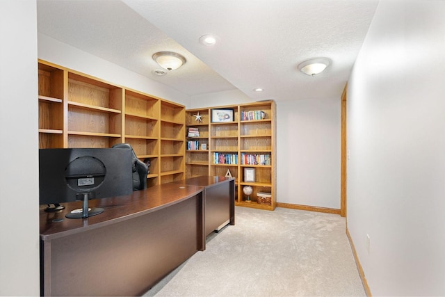 office featuring light carpet, recessed lighting, a textured ceiling, and baseboards