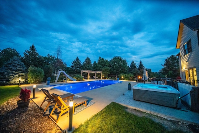 pool featuring a patio area, a water slide, an outdoor hot tub, and a pergola