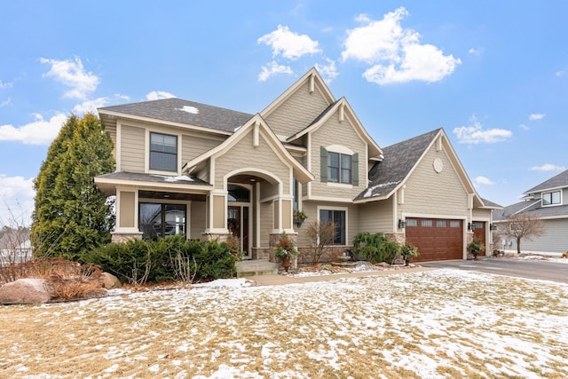 view of front of property featuring a garage and covered porch