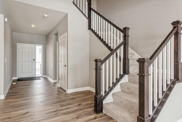 entryway with hardwood / wood-style floors