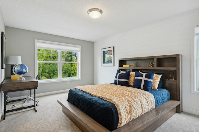 carpeted bedroom featuring a textured ceiling