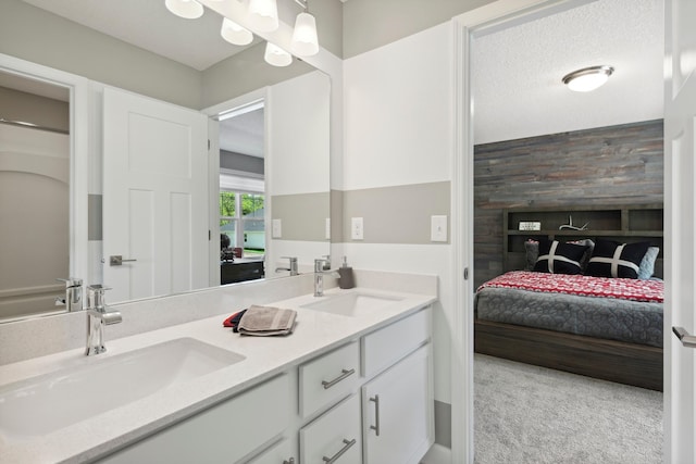 bathroom featuring vanity and a textured ceiling