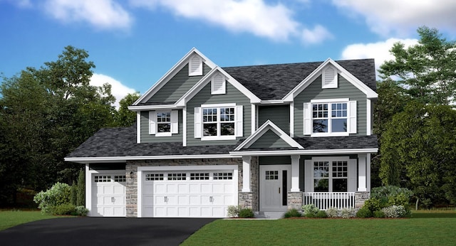 craftsman house with a garage, covered porch, and a front lawn