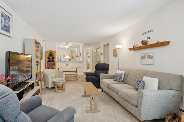 living room with light carpet and ceiling fan