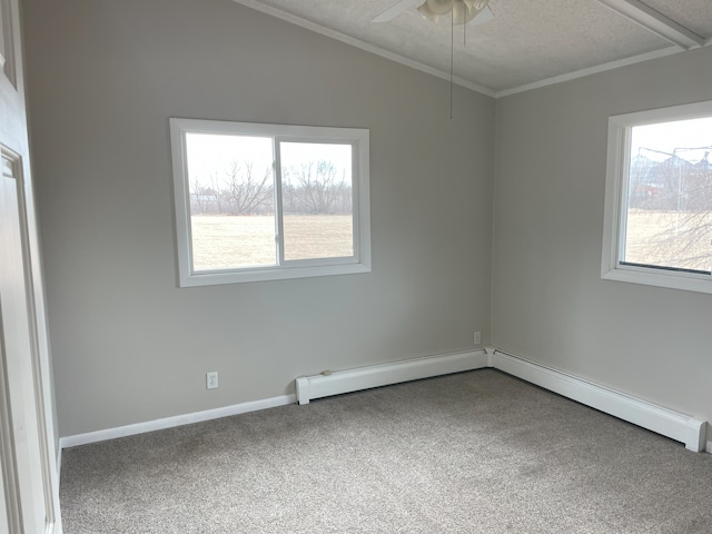 carpeted empty room featuring a baseboard radiator, ornamental molding, ceiling fan, and a textured ceiling