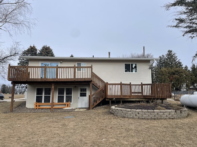 back of property with a wooden deck