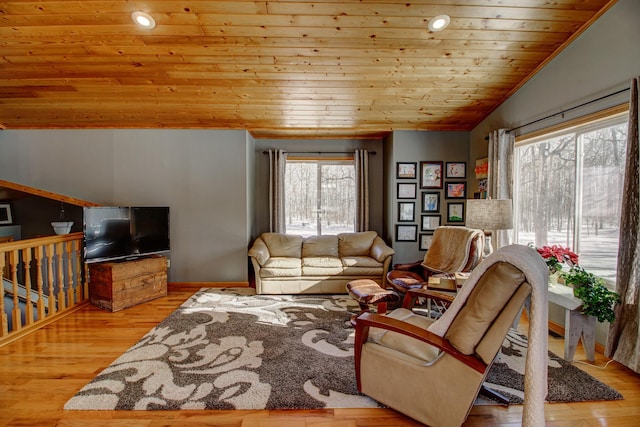 living room with wooden ceiling, baseboards, vaulted ceiling, and wood finished floors