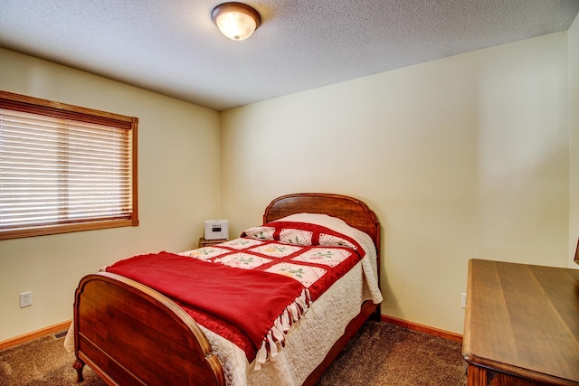 bedroom featuring carpet flooring and baseboards