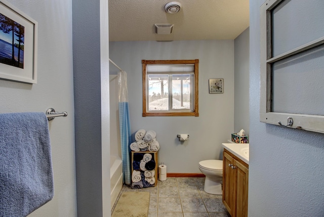 bathroom with vanity, visible vents, toilet, baseboards, and tile patterned floors