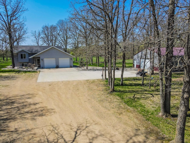 12483 135th Ave, Menahga, MN 56464 - view of yard featuring driveway and a garage