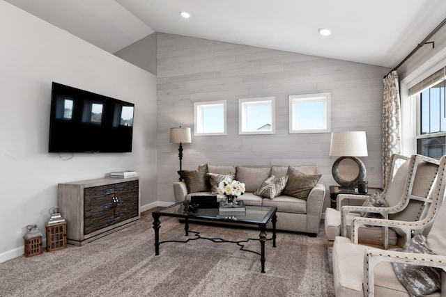 carpeted living room featuring vaulted ceiling