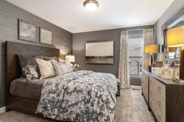 bedroom featuring light colored carpet