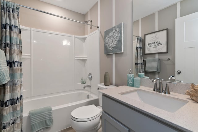 full bathroom with vanity, shower / bath combo, and toilet