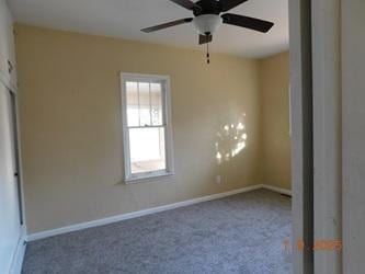 unfurnished bedroom featuring carpet floors and ceiling fan