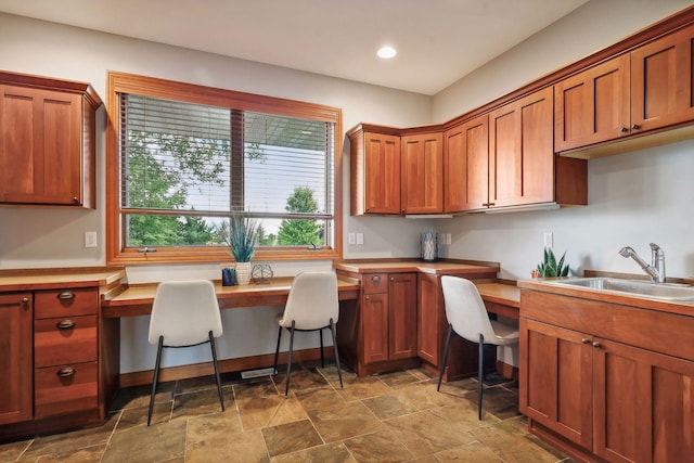 kitchen with built in desk and sink