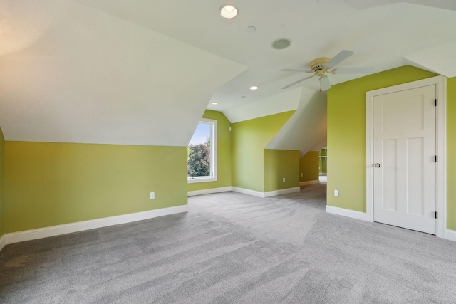 bonus room with lofted ceiling, light colored carpet, and ceiling fan