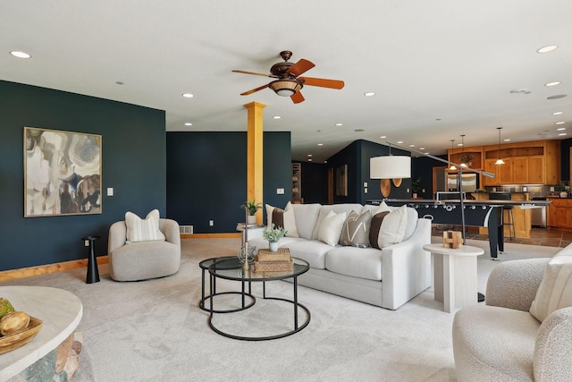 carpeted living room featuring ceiling fan