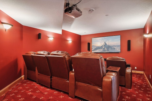 carpeted home theater with a textured ceiling