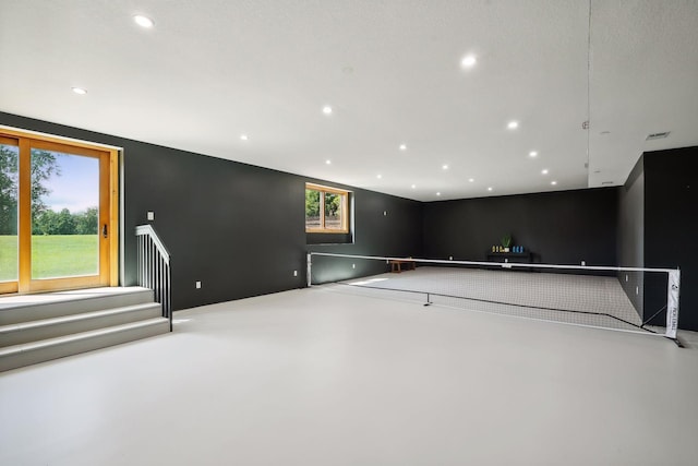 game room featuring concrete flooring