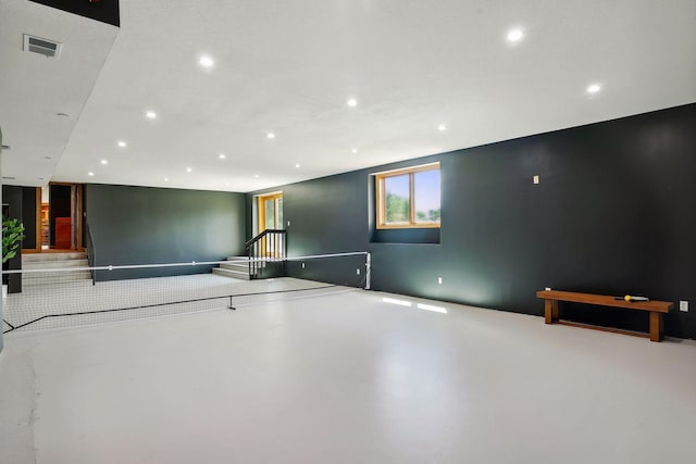 rec room with concrete floors