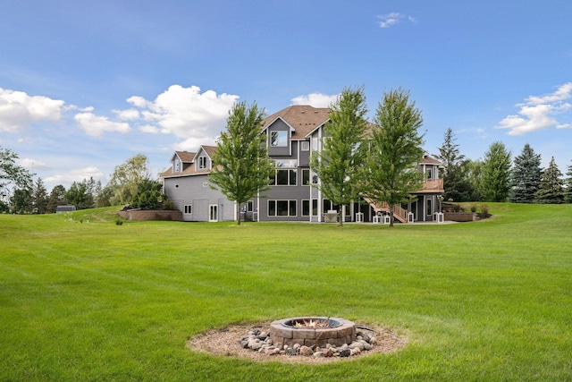 view of yard featuring an outdoor fire pit