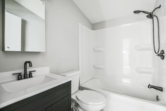 full bathroom featuring vanity, tub / shower combination, lofted ceiling, and toilet