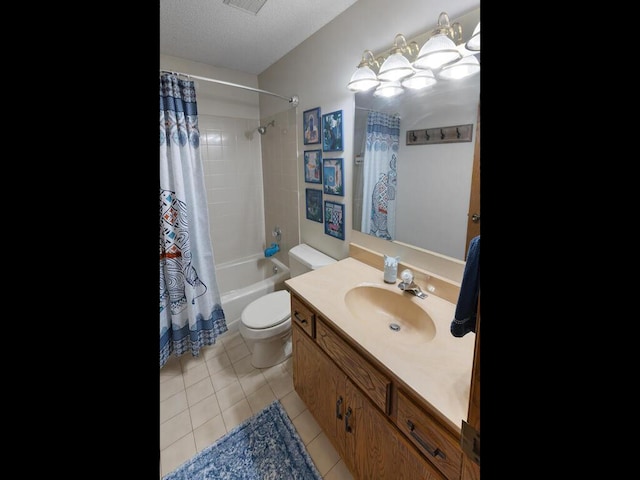 full bathroom featuring shower / bath combination with curtain, tile patterned flooring, vanity, toilet, and a textured ceiling