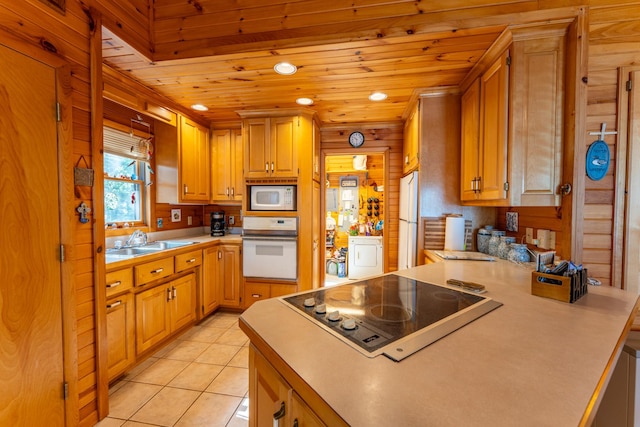 kitchen featuring white appliances, wooden ceiling, sink, and light tile patterned floors