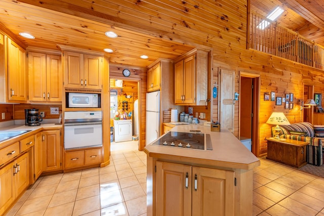 kitchen with white appliances, wooden walls, light tile patterned flooring, wooden ceiling, and kitchen peninsula