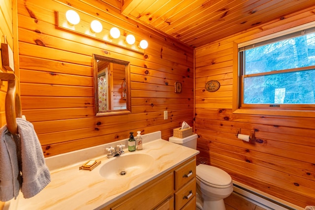 bathroom featuring wooden walls, a baseboard radiator, vanity, wood ceiling, and toilet