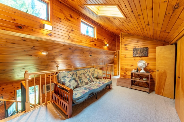 living area with wooden walls, wooden ceiling, vaulted ceiling with skylight, and carpet