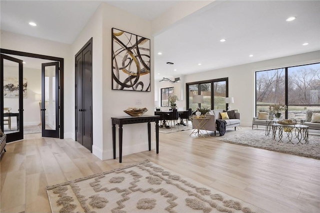 entryway featuring french doors and light hardwood / wood-style flooring