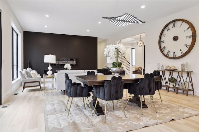 dining space with light wood-type flooring