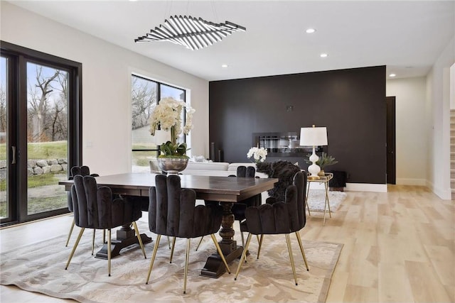 dining area featuring light wood-type flooring