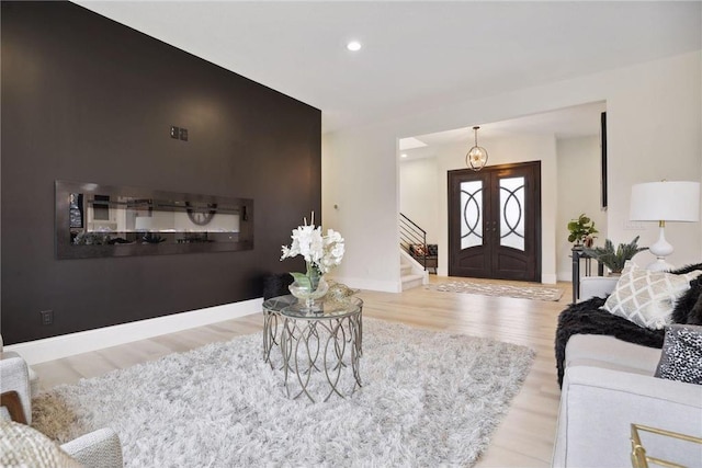 entrance foyer featuring light hardwood / wood-style floors and french doors