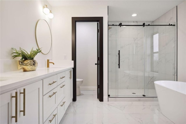 full bathroom featuring vanity, toilet, and separate shower and tub