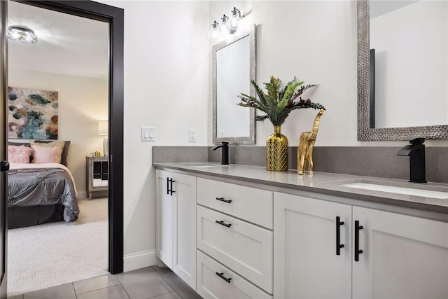 bathroom with vanity and tile patterned flooring