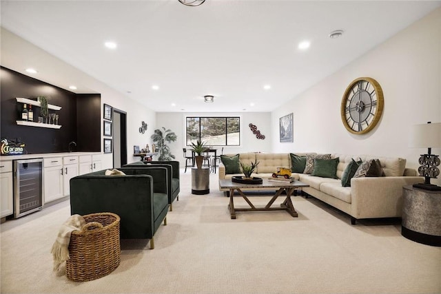 carpeted living room featuring beverage cooler and indoor bar