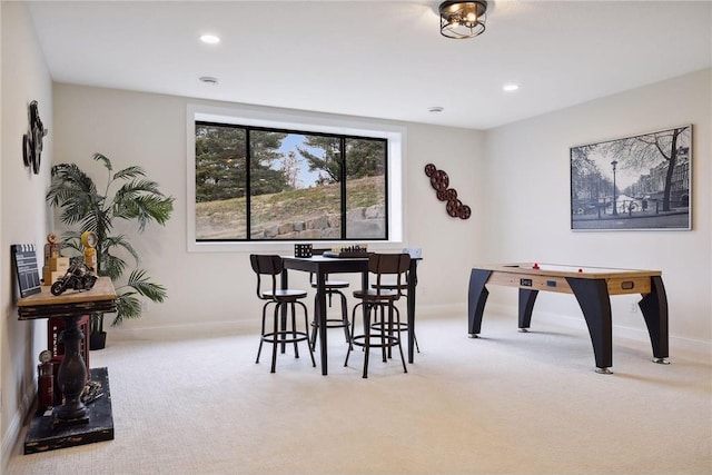 view of carpeted dining area