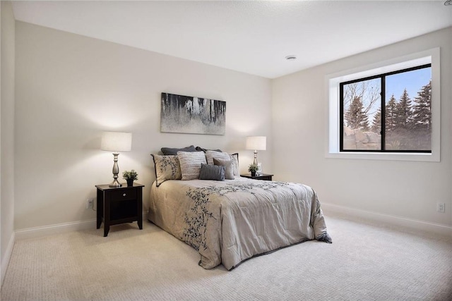 bedroom featuring light colored carpet